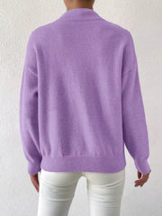 Lavender mock neck knit sweater with dropped shoulders, ribbed cuffs and hem.