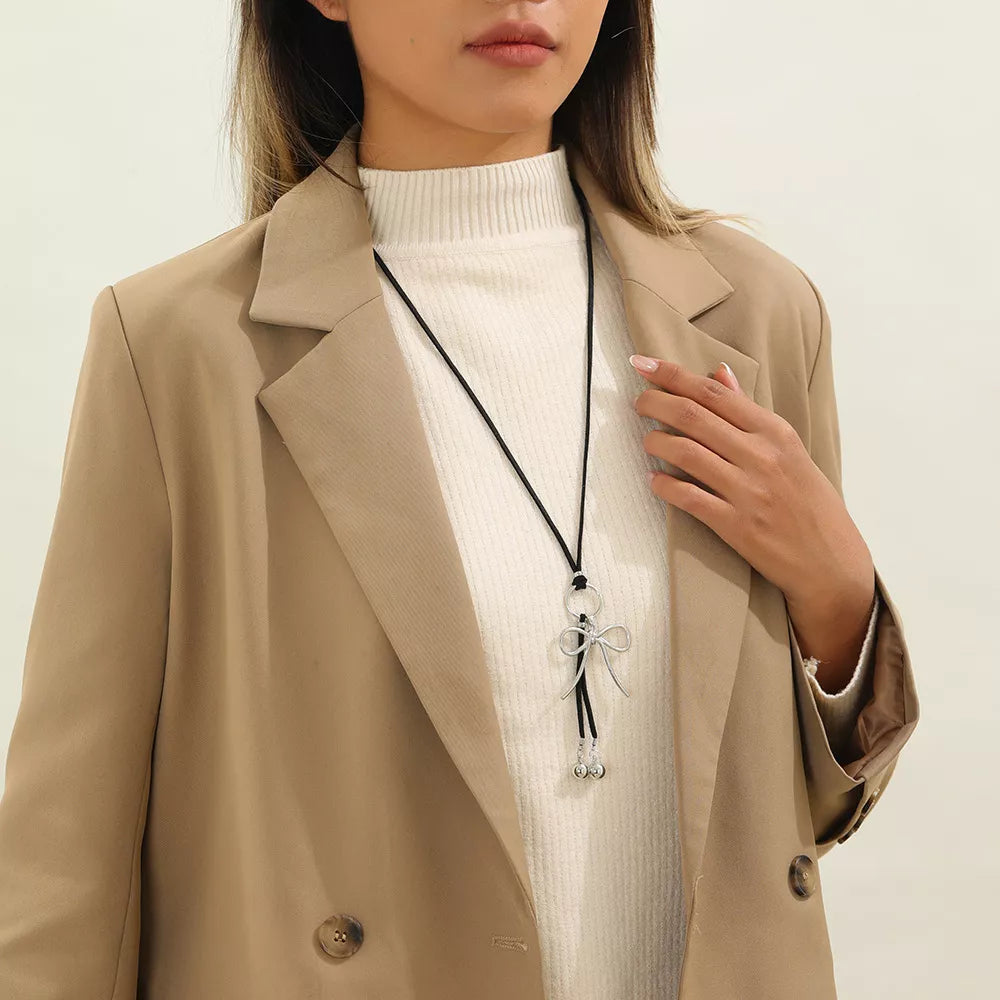 Elegant Bow Pendant Faux Leather Necklace in Silver, close-up detail