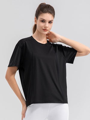 Black performance t-shirt with seam details and short sleeves.