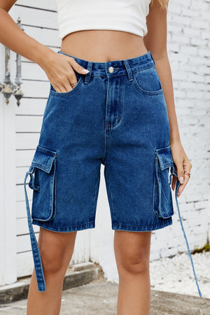 Medium blue denim cargo shorts with adjustable straps and utility pockets.