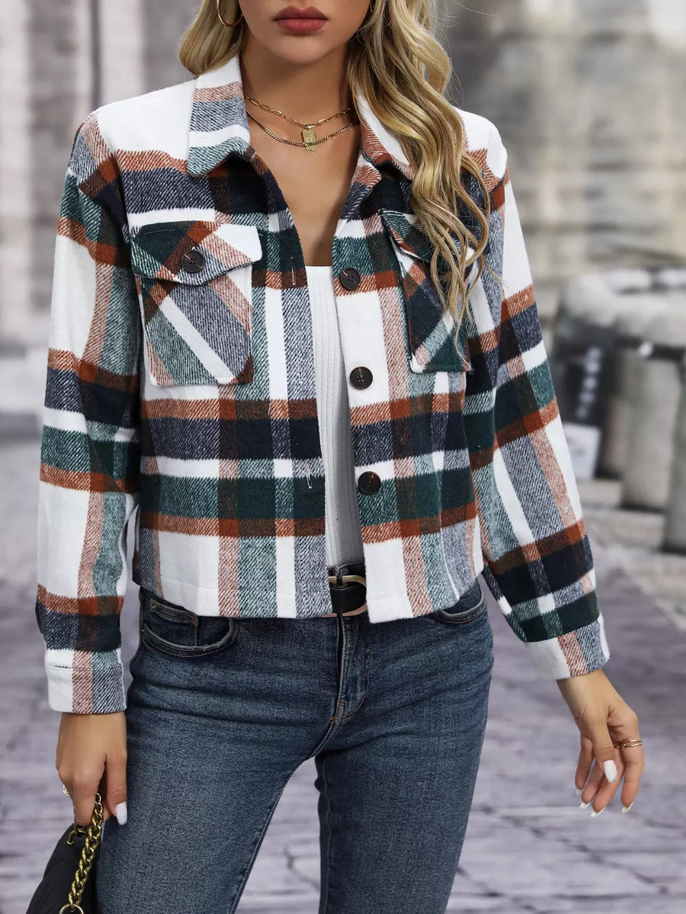 Plaid pocketed jacket with classic collar and button-down front.