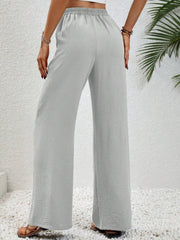 Light Gray textured palazzo trousers with drawstring waist and wide legs.