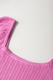 Red-Violet knit blouse with square neckline and flutter sleeves, featuring a textured pattern.