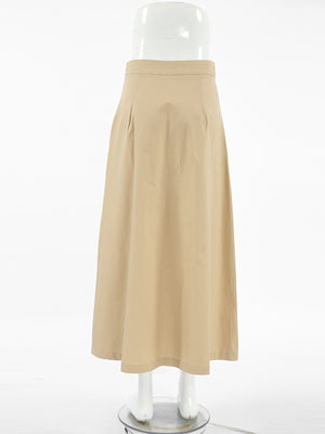 High-waisted A-line skirt in tan cotton with side pockets and a midi length.