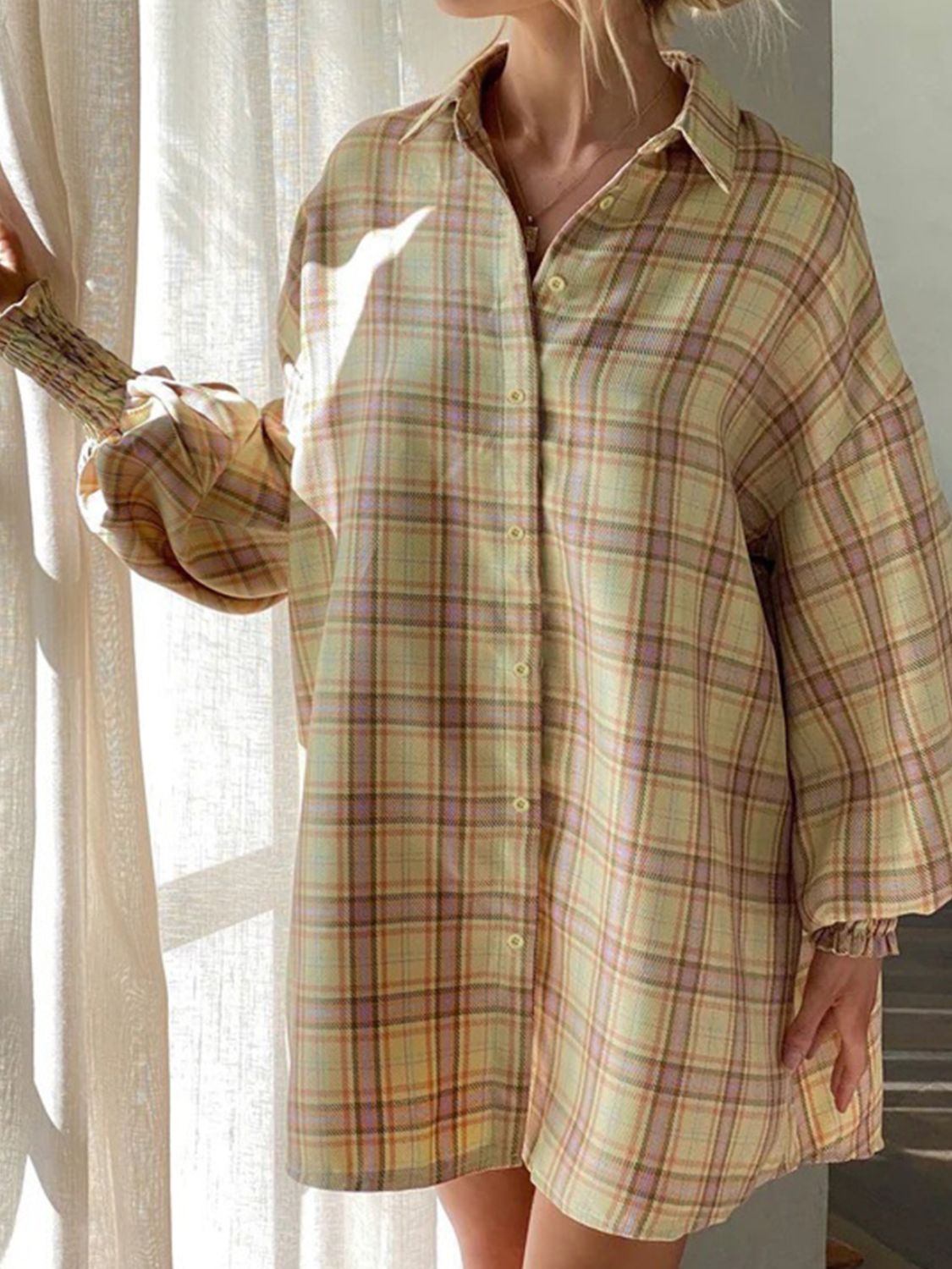 Pastel yellow plaid shirting jacket with ribbed cuffs and button front.