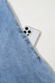 Light blue denim mini dress with a phone in the pocket