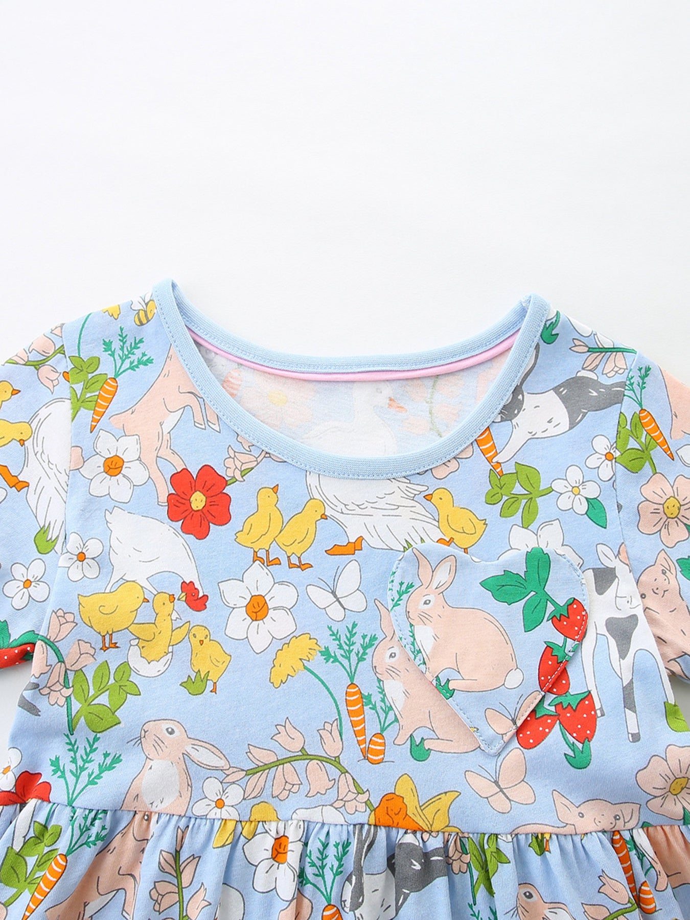 Light blue cotton toddler dress with cartoon farm animals, bunnies, chicks, and strawberries print.