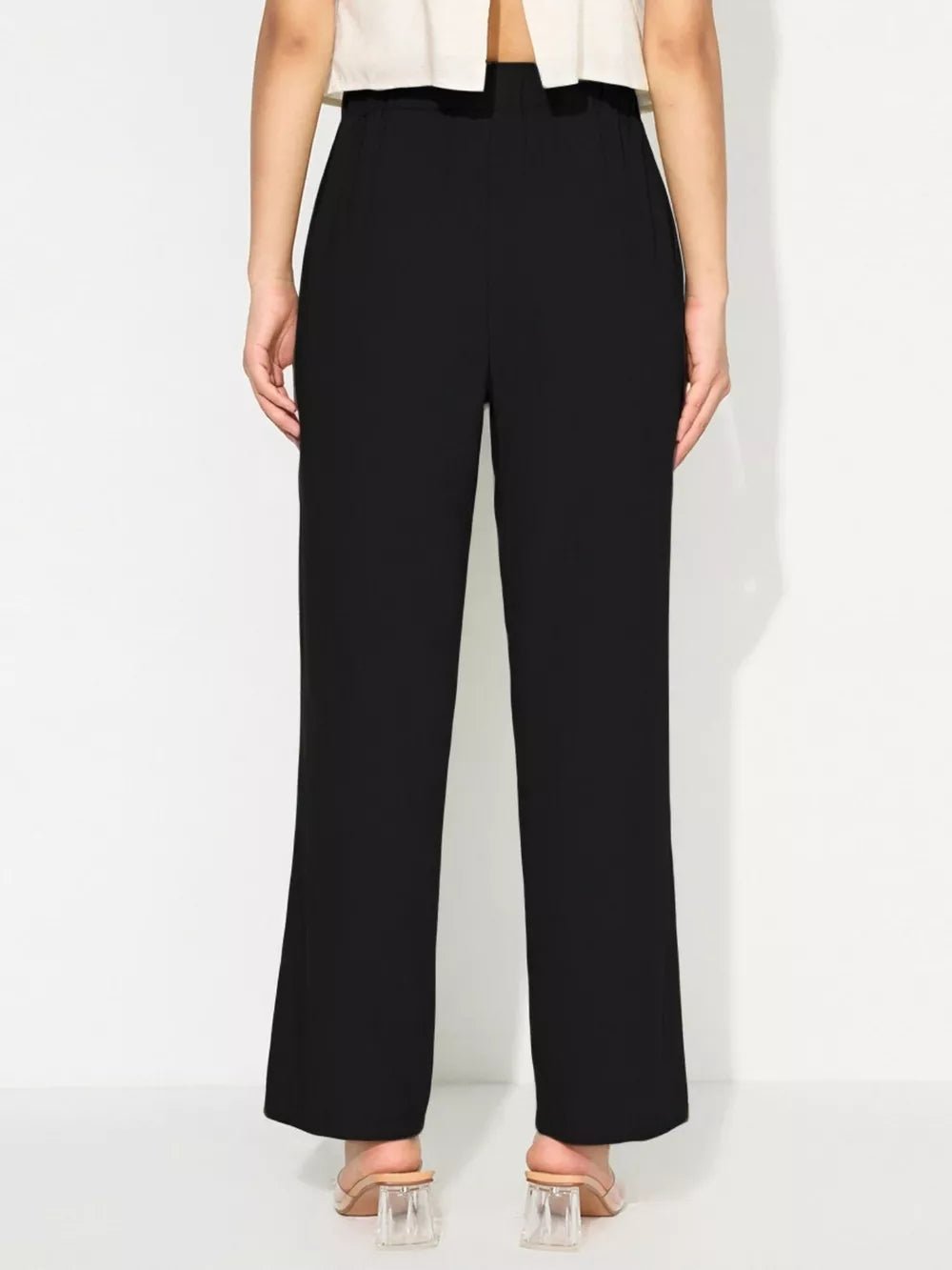 Black maternity pants with relaxed wide legs and tied detail at the waist.