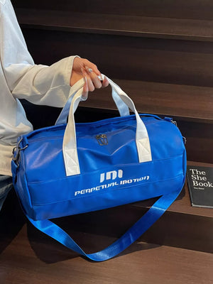 Blue pu leather sporty duffel bag with white handles and bold graphic text.
