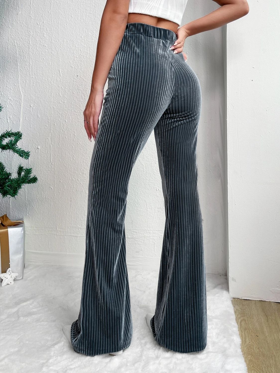 Textured corduroy bell bottom trousers in Teal, with a high waist and flared leg.