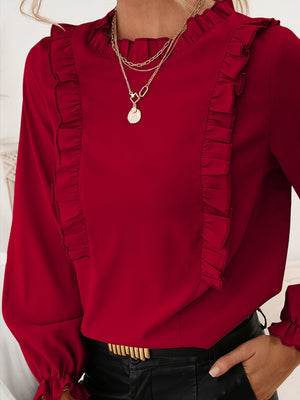 Burgundy ruffled yoke blouson sleeve top with a mock neckline.