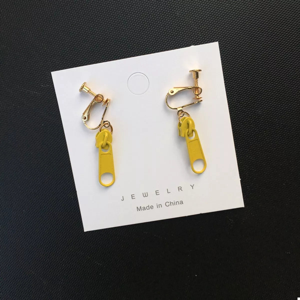 Yellow zipper dangle clip-on earrings with gold-tone hardware