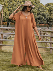 Caramel gathered sleeve wide-leg jumpsuit with a V-neck and flowing pants.