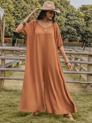 Caramel gathered sleeve wide-leg jumpsuit with a V-neck and flowing pants.