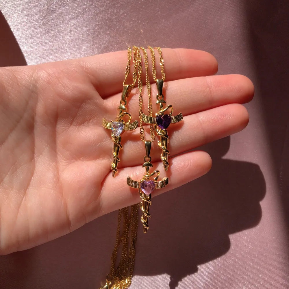 Heart-Set Cross Charm Pendant Necklace with white, purple, and pink stones, 18K gold-plated.