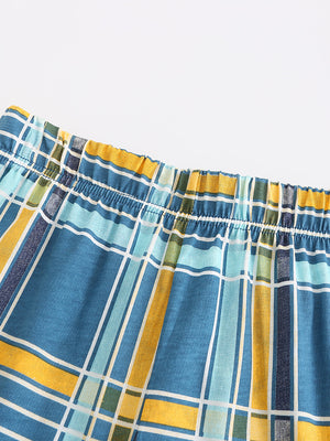 Boys' blue plaid elastic waist shorts with yellow and green accents.