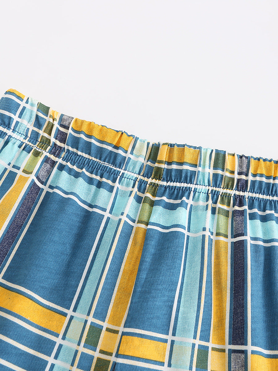 Boys' blue plaid elastic waist shorts with yellow and green accents.