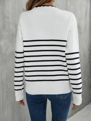 White and black striped knit sweater with scalloped trim neckline and ribbed cuffs.