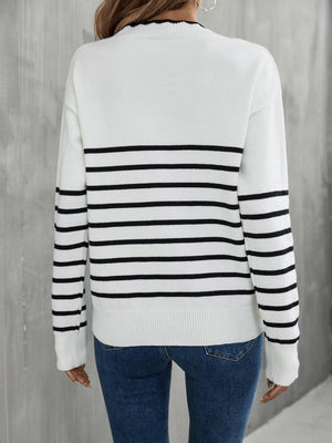 White and black striped knit sweater with scalloped trim neckline and ribbed cuffs.