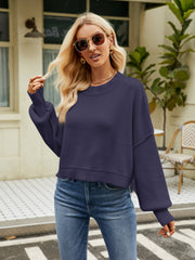 Cobalt blue acrylic dropped shoulder knit sweater with balloon sleeves and crew neck.