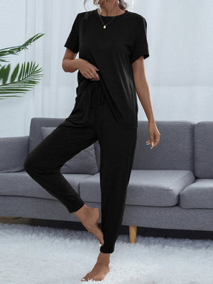 Black relaxed-fit tee and jogger lounge set with drawstring waist and cuffed ankles.