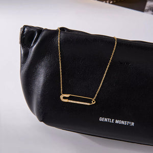 Gold paperclip necklace with pave crystals on a delicate chain.