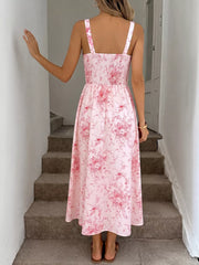 Pink floral cami midi dress with smocked bodice and frill straps.