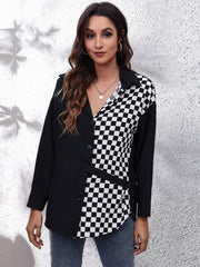 Checkerboard panel button-down blouse in black and white polyester with a collared neckline.