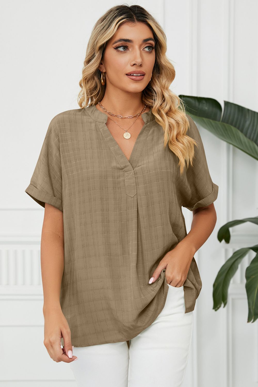 Camel linen blend blouse with V-neck, short sleeves, and subtle plaid texture.