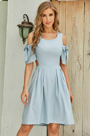 Light blue fit-and-flare dress with cold shoulders and bow sleeves