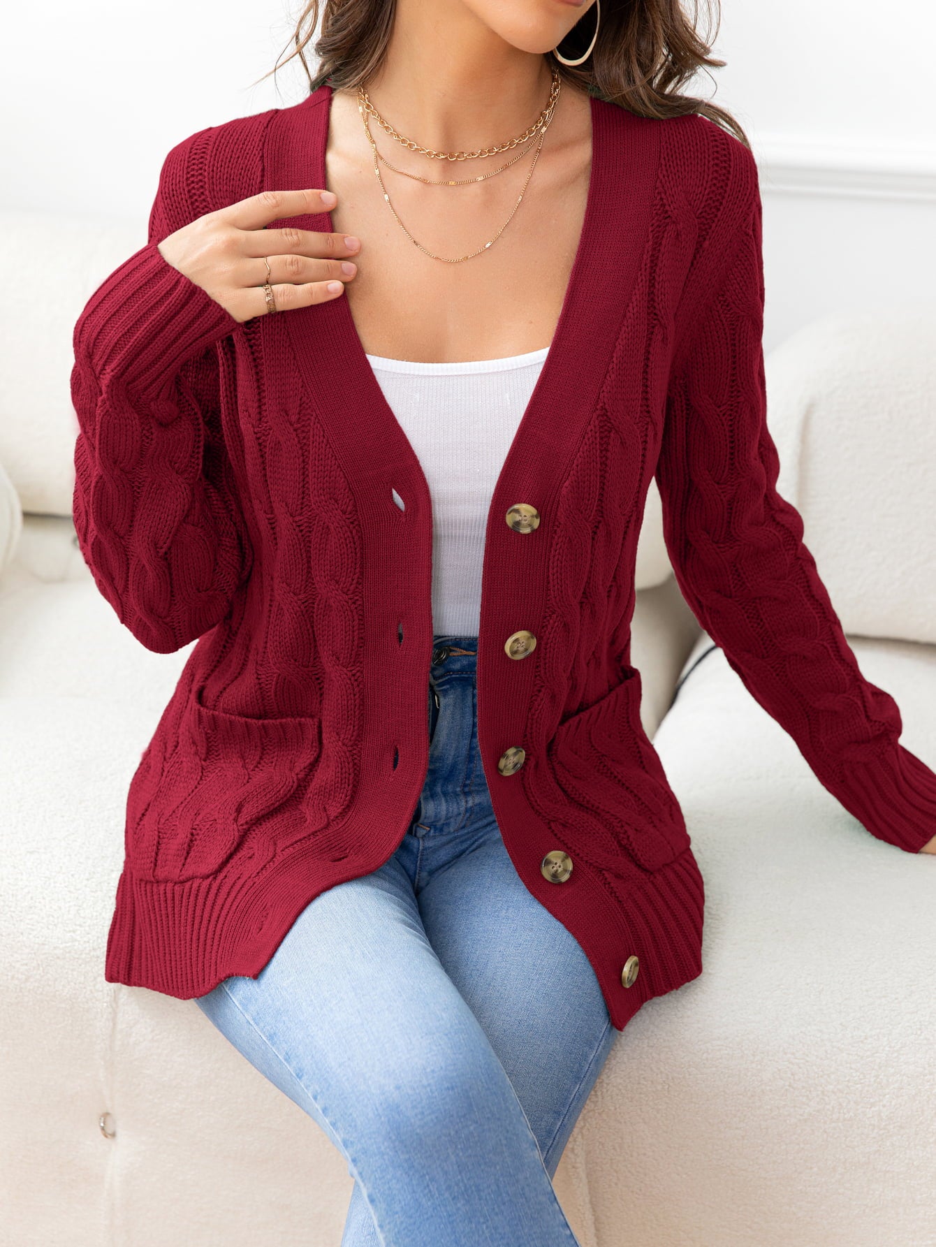 Deep Red textured cable-knit cardigan with buttons and pockets.