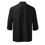 Black half-button shirt with roll-up sleeves and mandarin collar.