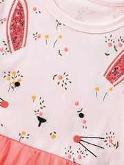 Pink cotton toddler dress with bunny face, floral print, and tulle skirt detail.