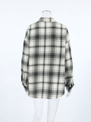 Button-up long sleeve shirt in black and white plaid cotton, shown from the back.