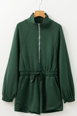 Dark green drawstring waist romper with funnel neck and quarter zip