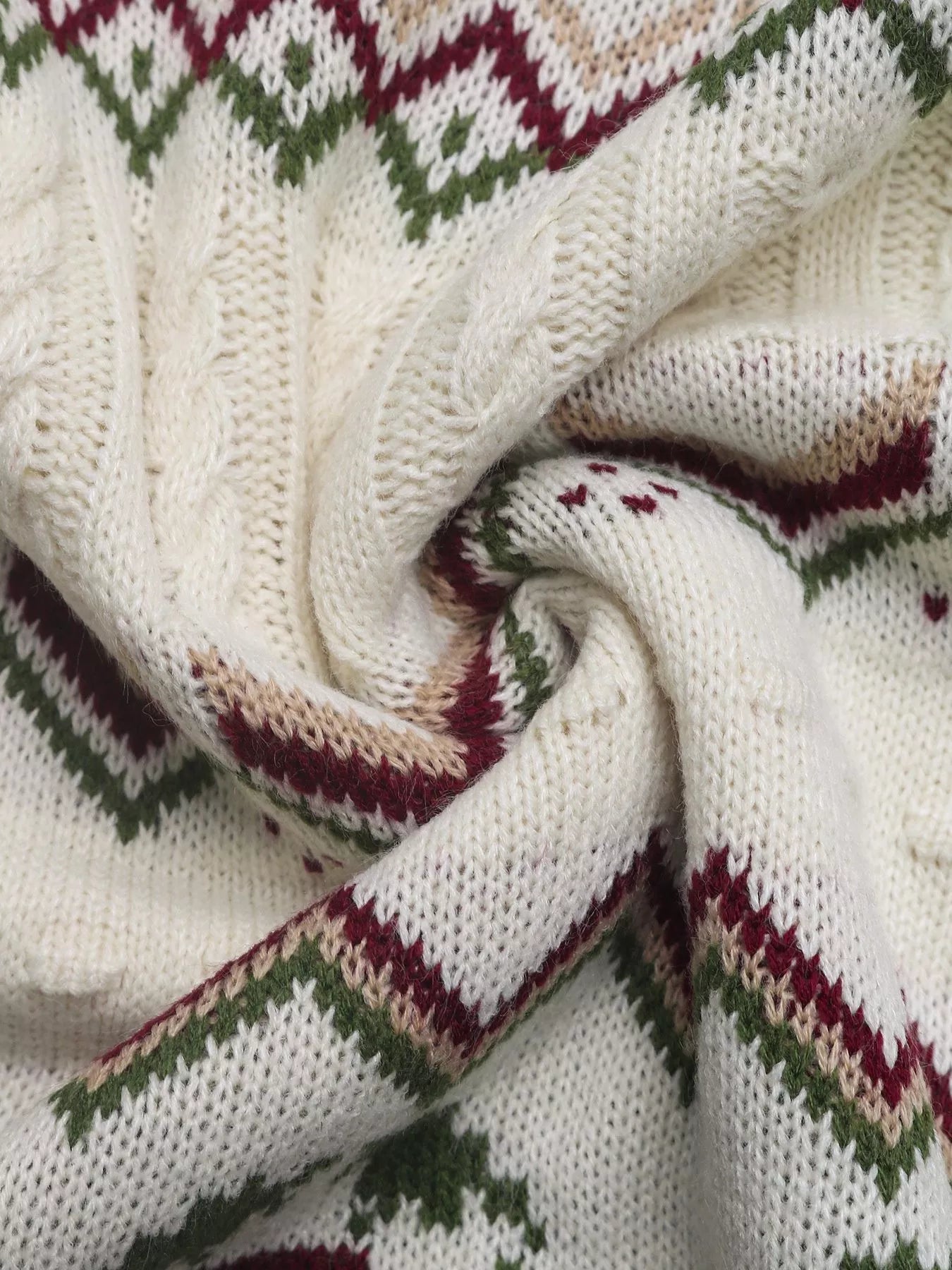 Ivory cable-knit turtleneck sweater with geometric pattern and cable knit details.