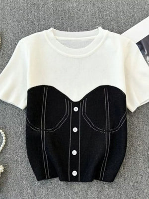 Color block knit t-shirt in white with black bustier detail, ribbed neckline and button front.
