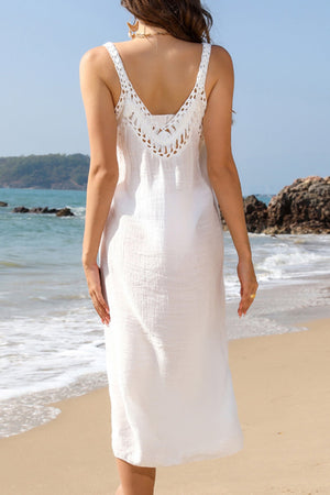 White crochet yoke slit maxi dress with V-neck and spaghetti straps.