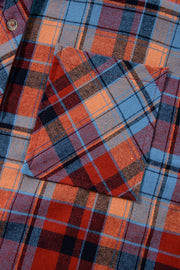 Oversized shacket with button-down collar in orange and deep red plaid, featuring a chest pocket.