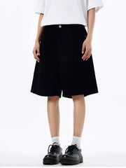 Black chino shorts with drawstring detail, mid-thigh length.