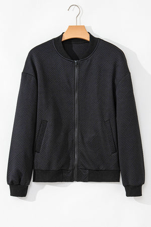 Black bomber jacket with diamond quilting and zip front.