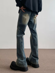 Men's blue vintage wash flare jeans with distressed details