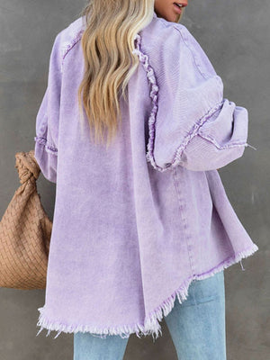 Lavender frayed denim overshirt with raw hem detail and distressed cuffs.