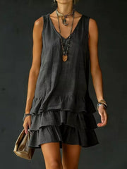 Grey tiered ruffled hem v-neck sleeveless dress with layered ruffles.