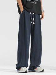 Men's navy blue relaxed fit sweatpants with drawstring waist and pockets.