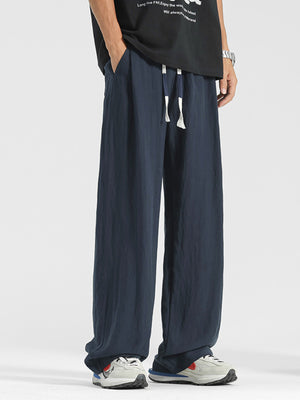 Men's navy blue relaxed fit sweatpants with drawstring waist and pockets.