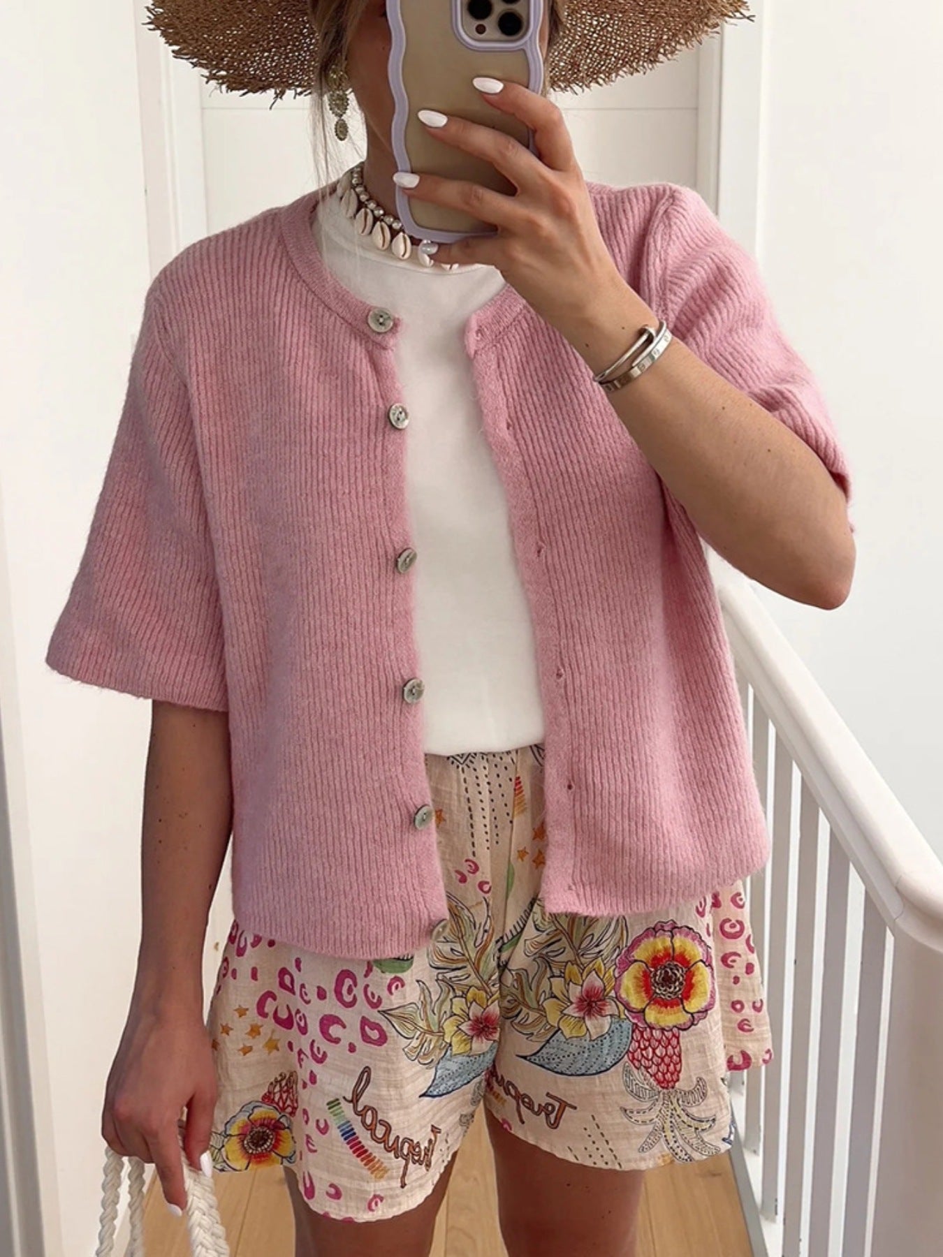 Dusty Pink ribbed button-down cardigan with short sleeves and a slightly cropped fit.