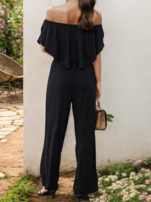 Black off-the-shoulder flounce jumpsuit with wide legs.
