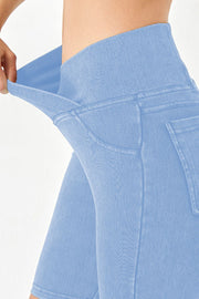 Peacock Blue denim bermuda shorts with a crisscross waistband detail.