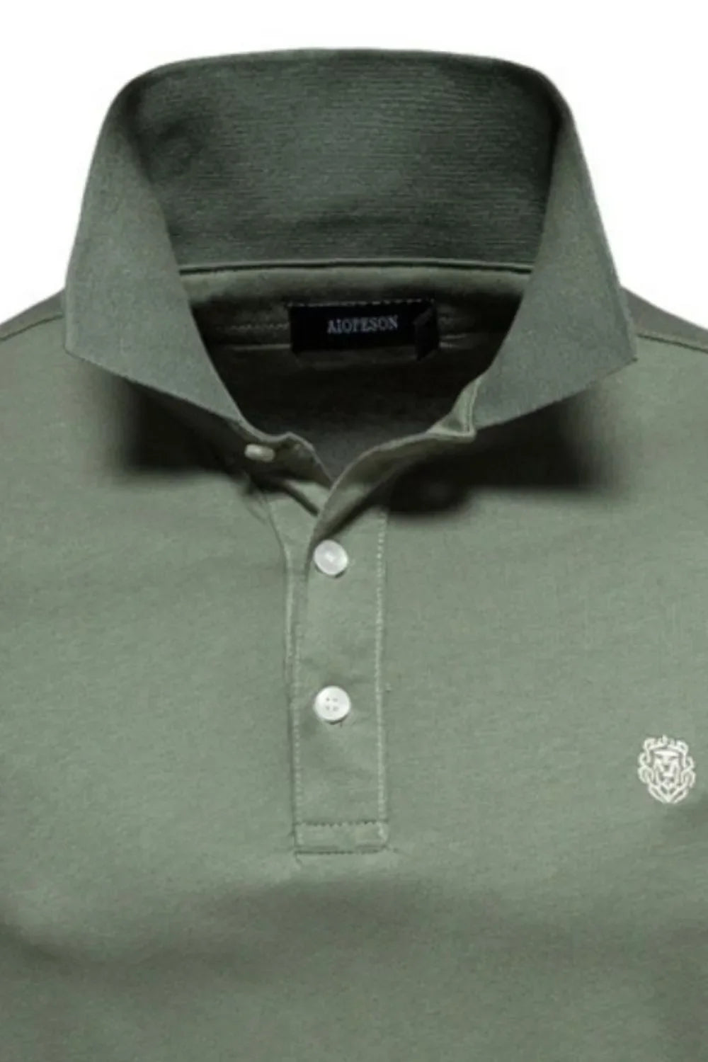 Moss green cotton polo shirt with embroidered crest detail and button placket.